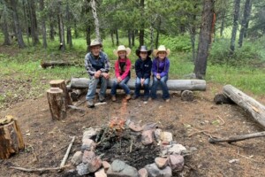 Dee with great-granddaughters at the Mill Creek Camp Dee with great-granddaughters